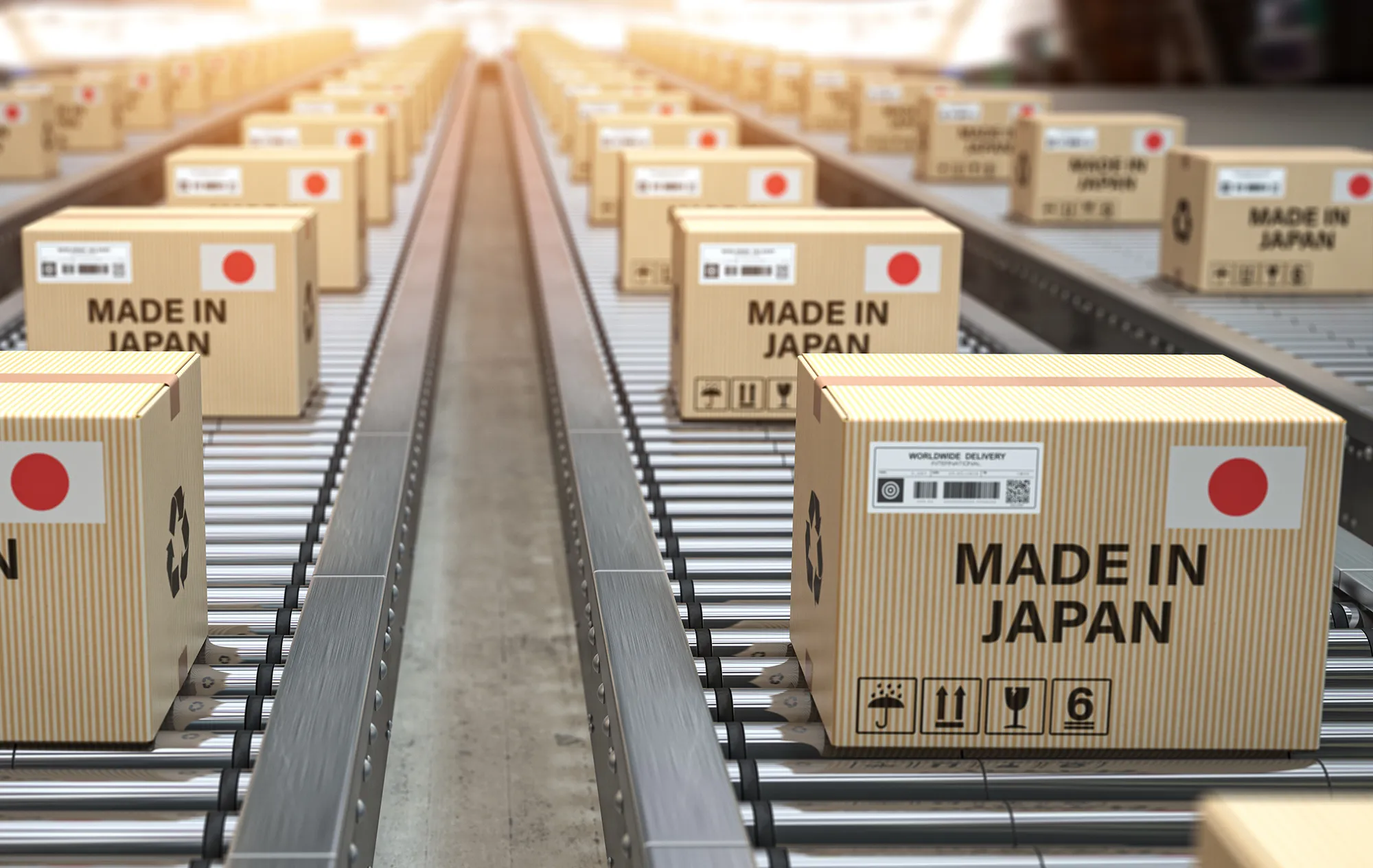Rows of cardboard boxes printed with a red circle on white and the words Made in Japan, on roller conveyors