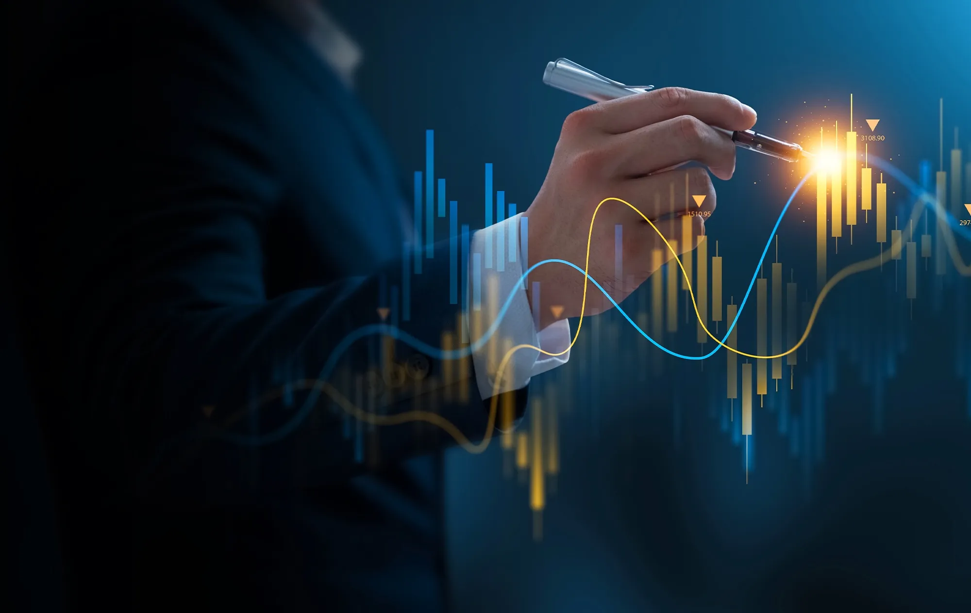 A hand in a white shirt cuff pointing a pen at a glowing line chart and candlestick bars on a dark blue background