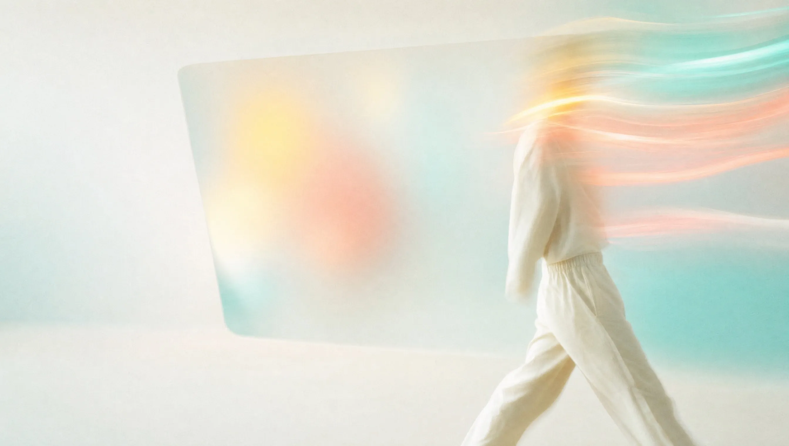 A person in light clothes walking past an empty frosted glass panel in soft daylight, head and shoulders trailing off into long streaks of teal, coral and yellow light, for a post on SEO vs SEM and the search results page
