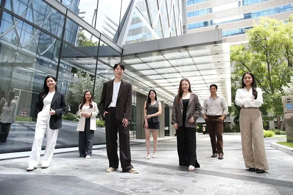 The Primal team walking together between office towers