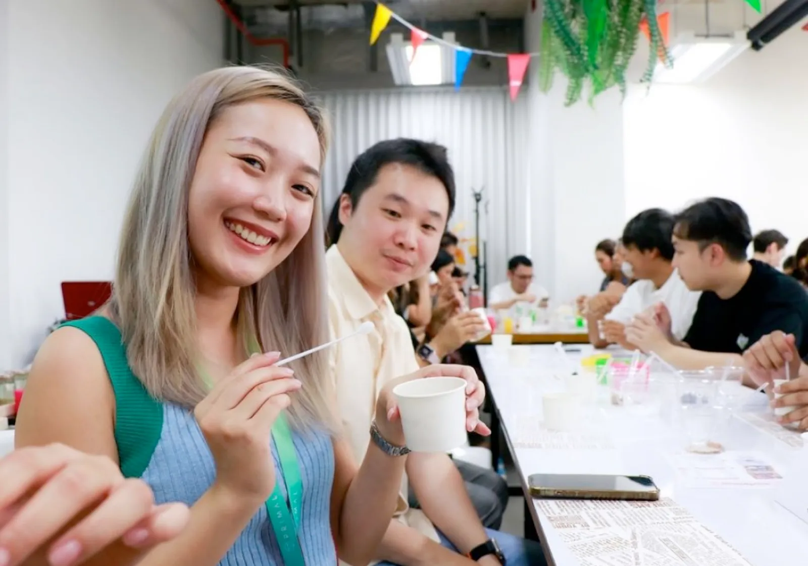 Primal colleagues smiling at a long workshop table