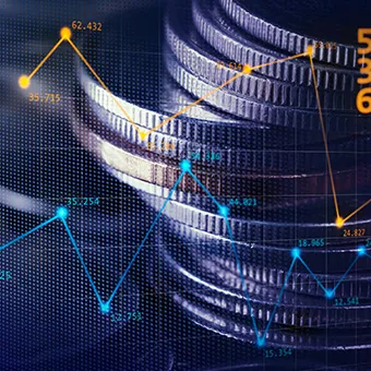 Blue and orange line charts with data points over stacks of coins
